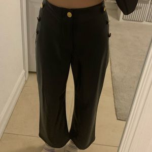 Chic leather pants with golden buttons. 🌃💫